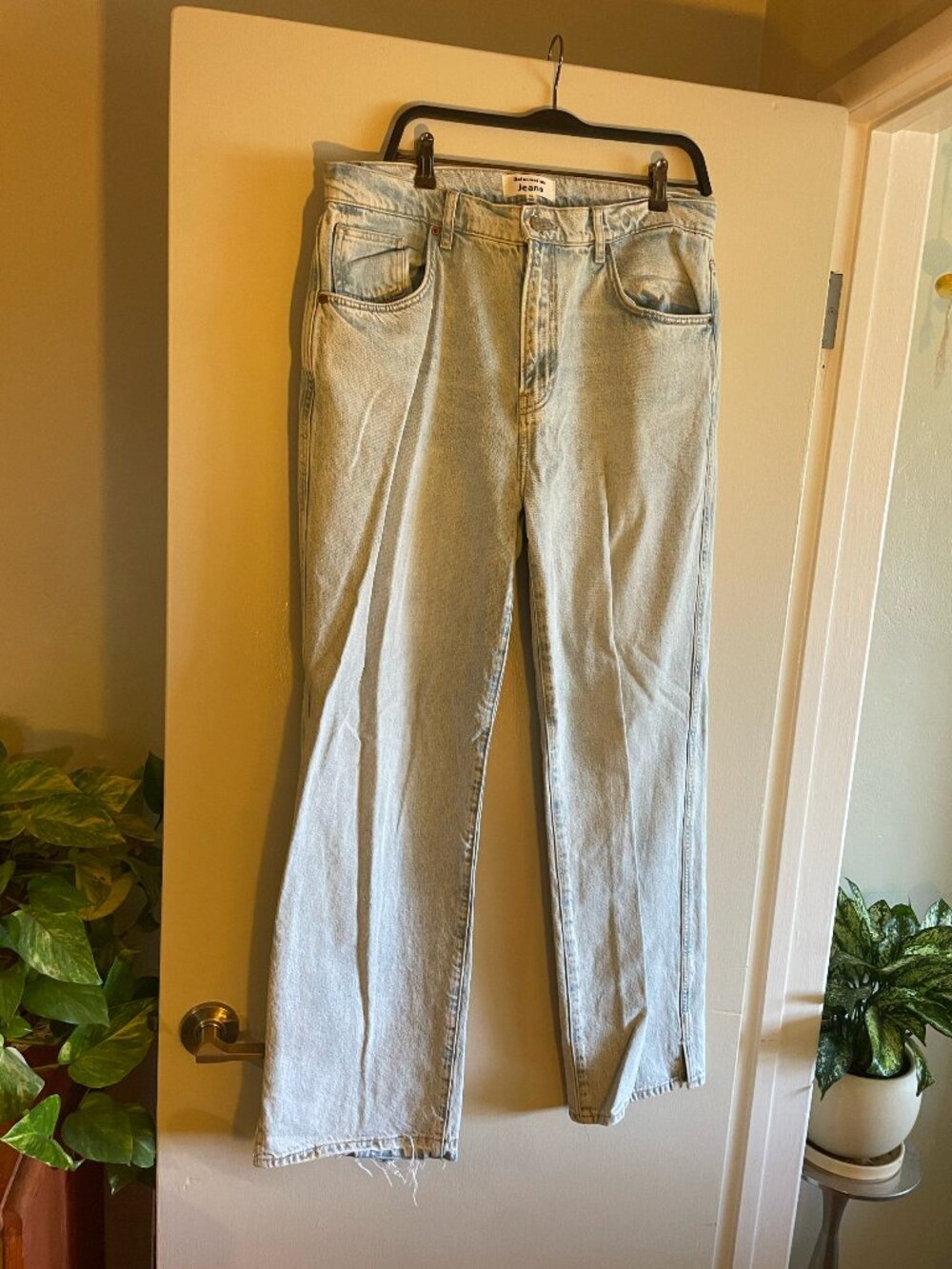 Reformation light wash, relaxed-fit denim jeans with a frayed hem